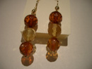 Cognac and lemon colour amber earrings - round faceted beads